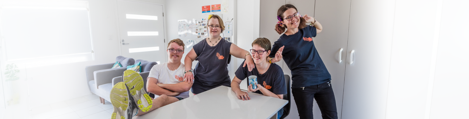 Four STEPS Pathways Boarding College students smiling while inside a Boarding College accommodation.