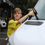 Caelan washing a car