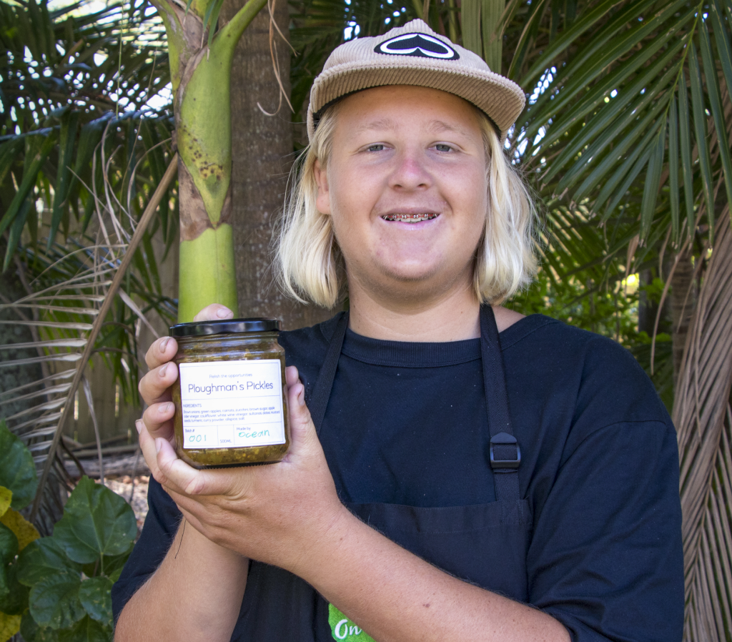 STEPS Pathways College participant holding a jar of Pathways to Plates Ploughman's Pickles