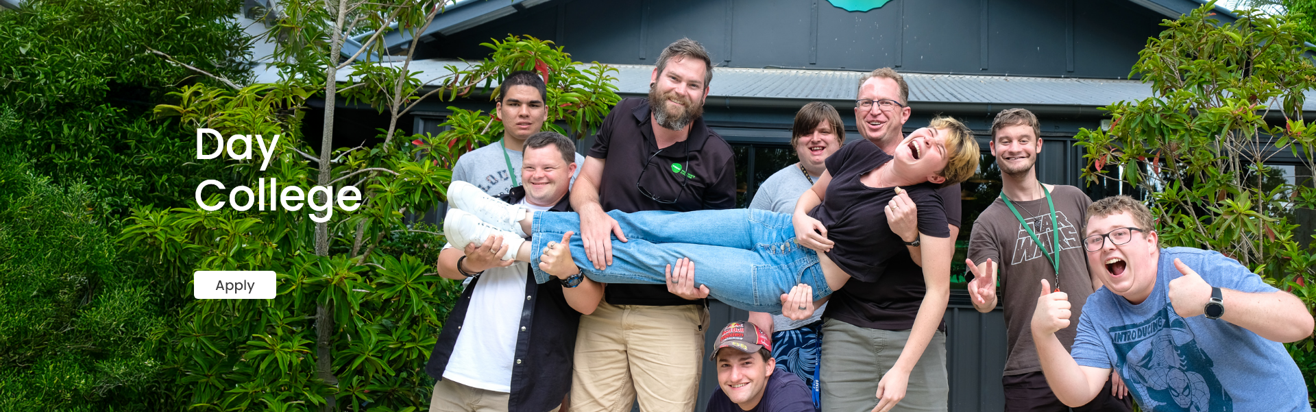 A banner of STEPS Pathways College participants and trainers smiling and laughing outside of the STEPS Cafe on George with overlay text saying 'Day College' and a button saying 'Apply'