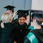 Student Sonya receiving her graduation cap