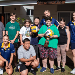 STEPS Pathways College students standing with with Sunshine Coast Lightning players