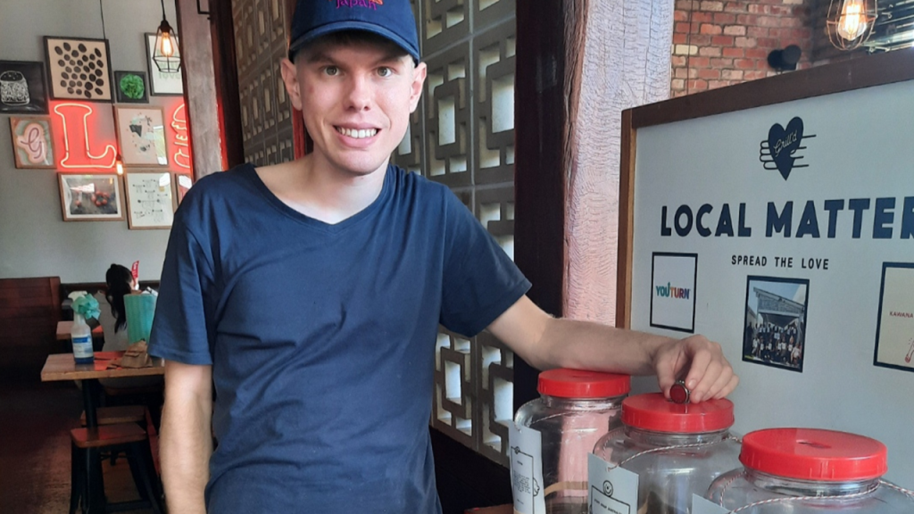 Jack voting for STEPS Pathways Charity for Grill’d Kawana’s Local Matters program.